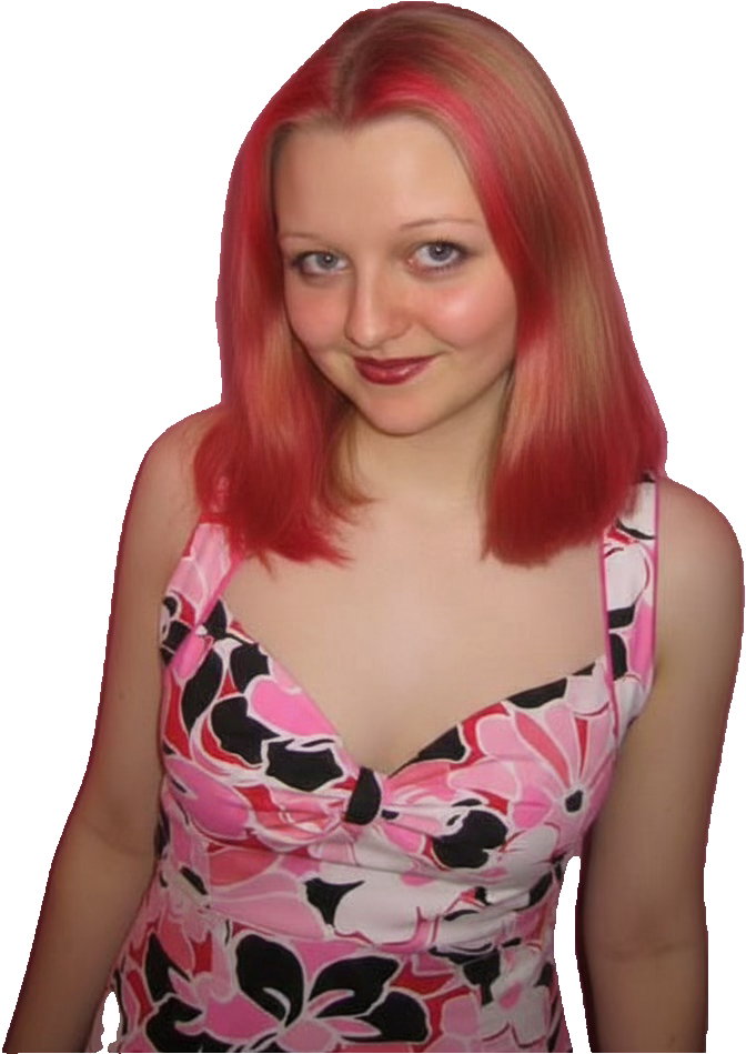 Vanessa, smiling, with bright red hair